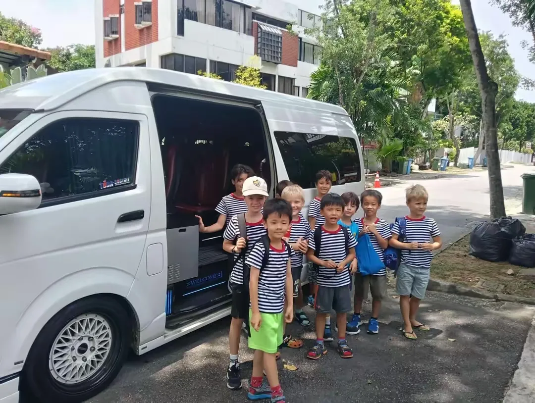 A group of children ready to board the van