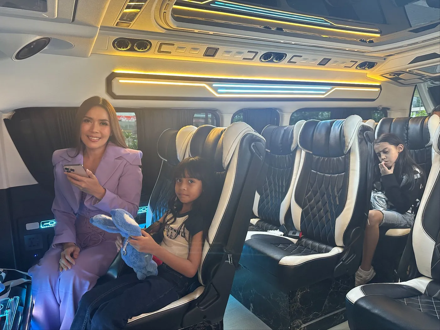 Passengers settled into the VIP van at night