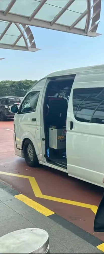 The van waiting at the airport kerb